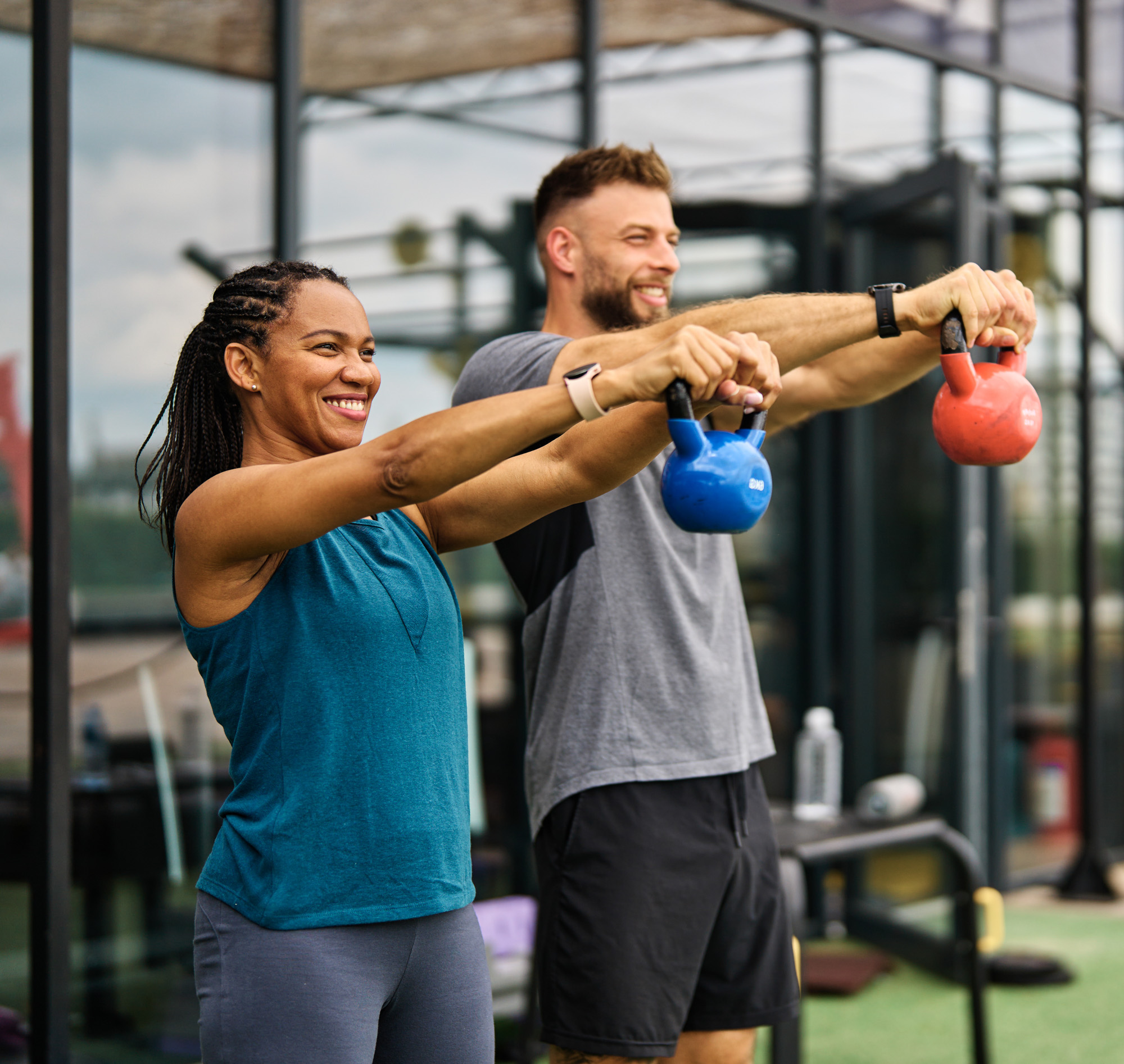 a man and woman lifting weights