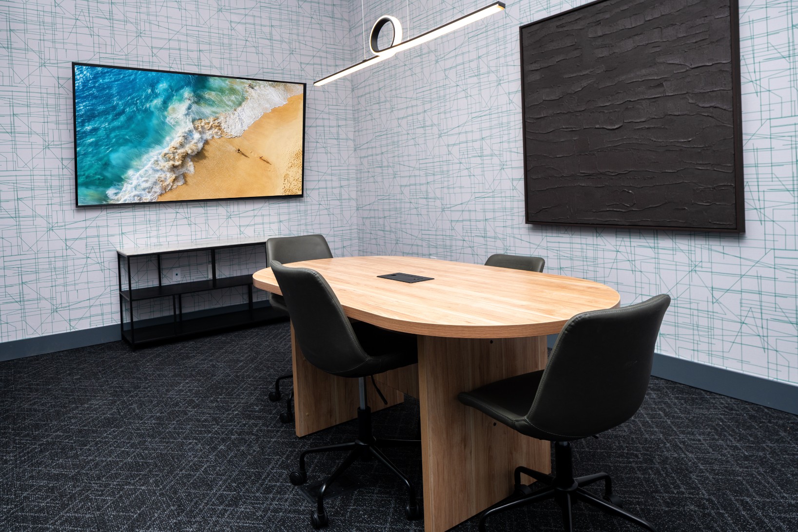 Meeting room with large TV screen at Legacy Metro 525