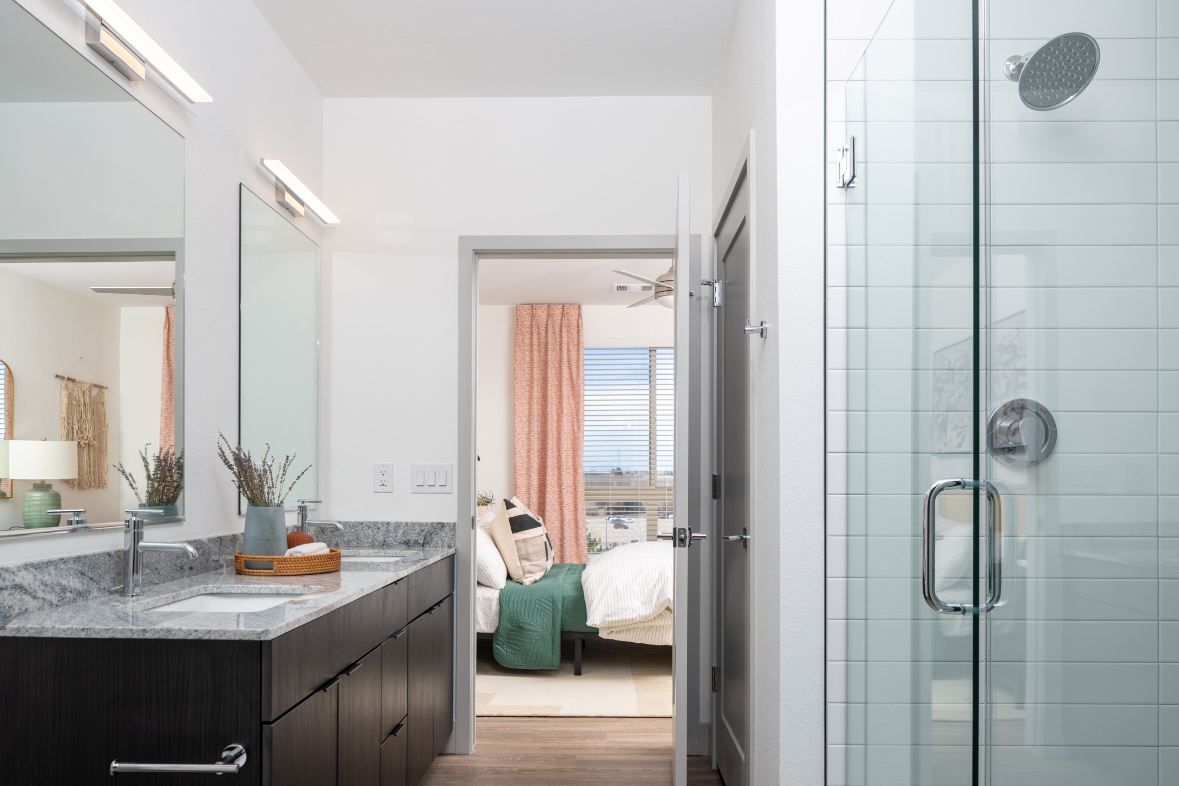 Model bathroom with walk-in shower at Legacy Metro 525
