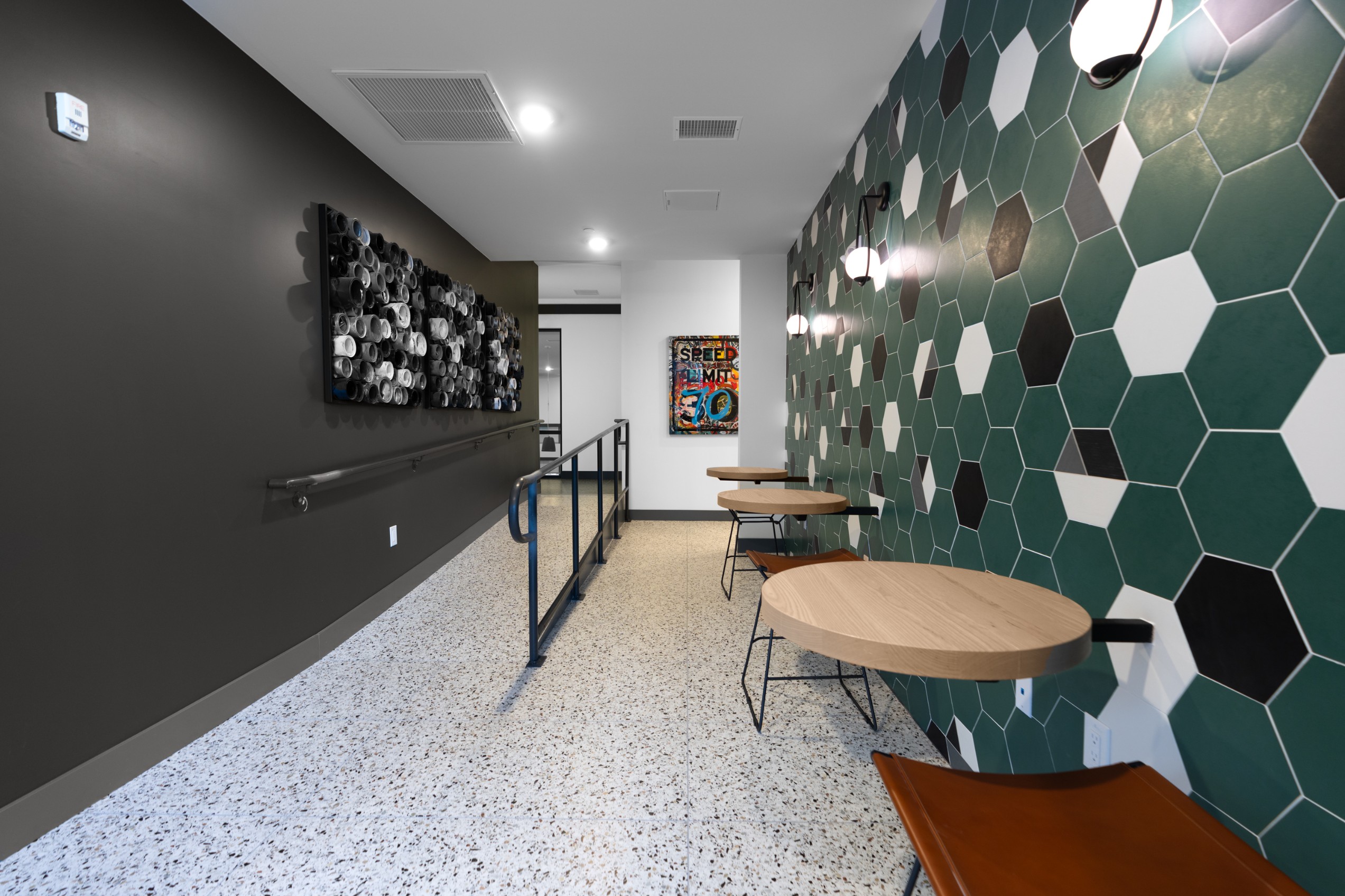 Tables in the coworking lounge at Legacy Metro