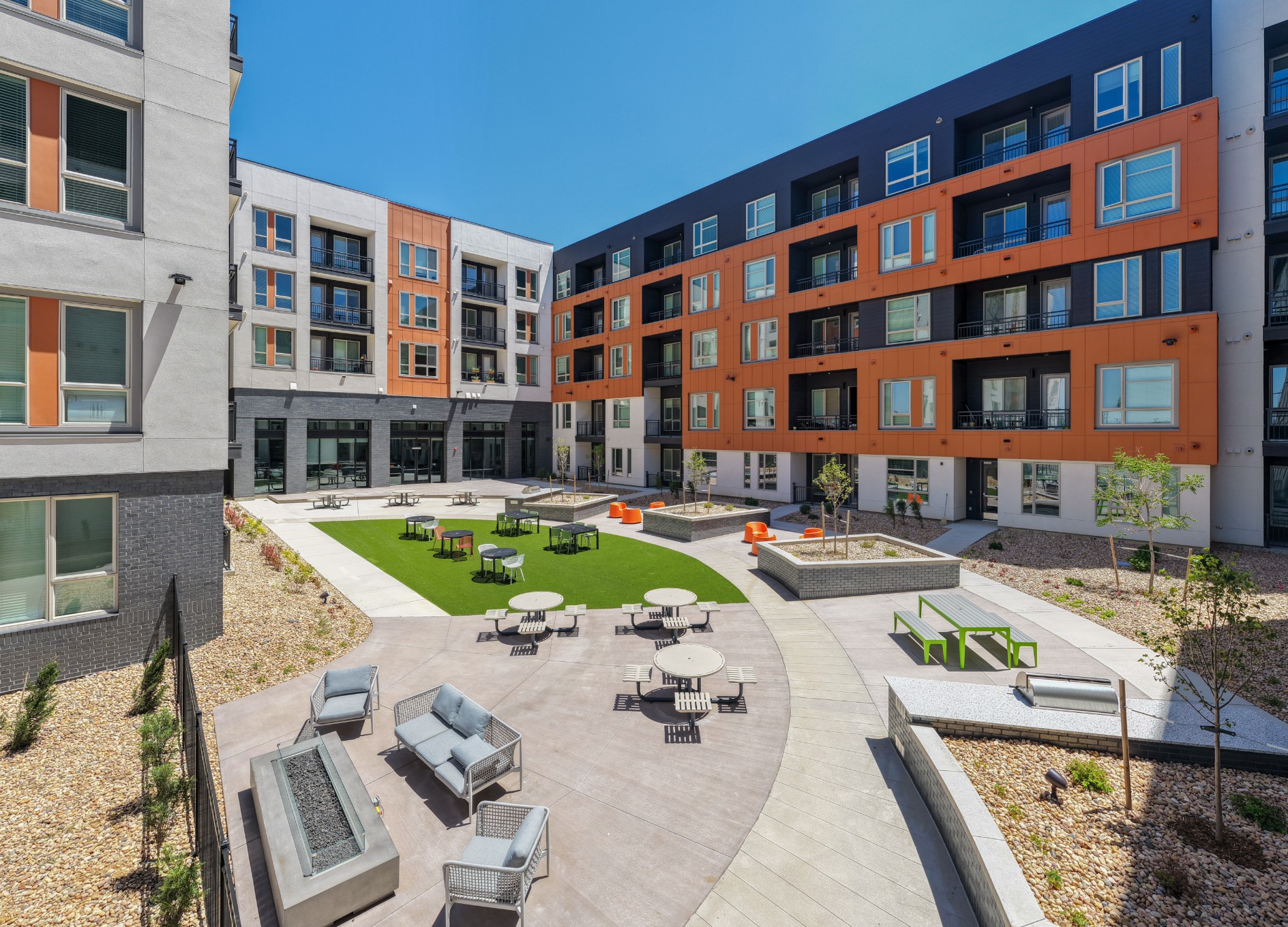 Sunny courtyard with a gas firepit