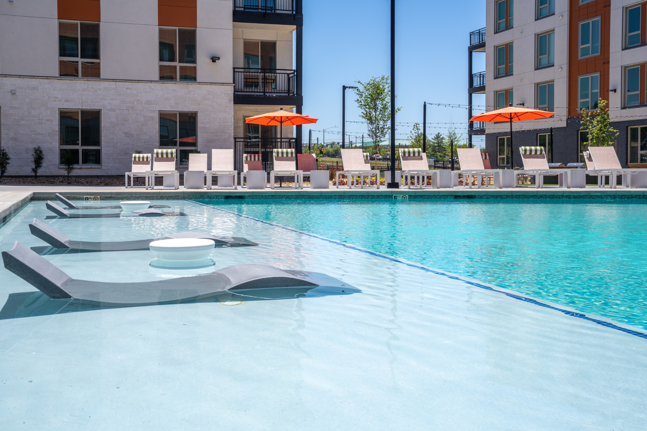 In-pool loungers in the resort-style pool