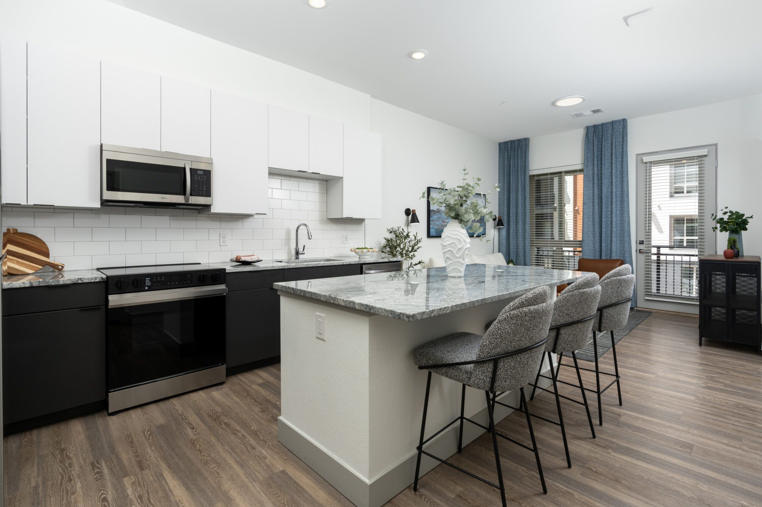 Large kitchen island with bar seating at Legacy Metro 525